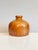 A distinctive studio ceramic vase by Hubertus Menzel from the 1970s. The hand-sized stoneware impresses with its serene,...
