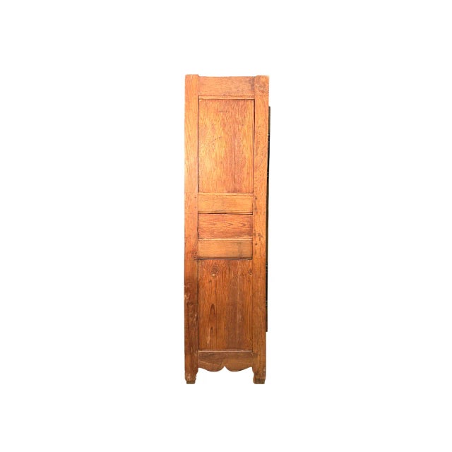 Compact and solid 18th century walnut wardrobe with two worked doors and panelled sides.