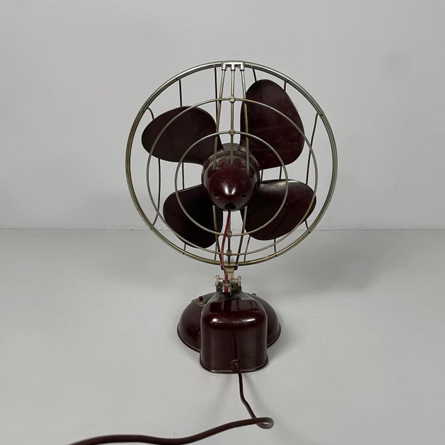Italian mid-century modern table fan by elettrodomestici San Giorgio, 1960s Adjustable table fan with burgundy Bakelite...