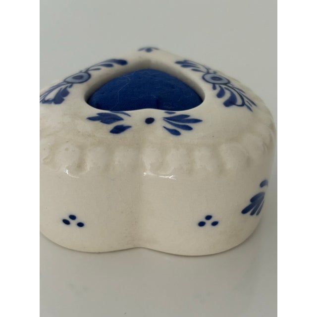 This Little Delft Pincushion is a Wonderful Addition to any Sewing Room.It has a Blue Heart with Hand Painted Decoration...