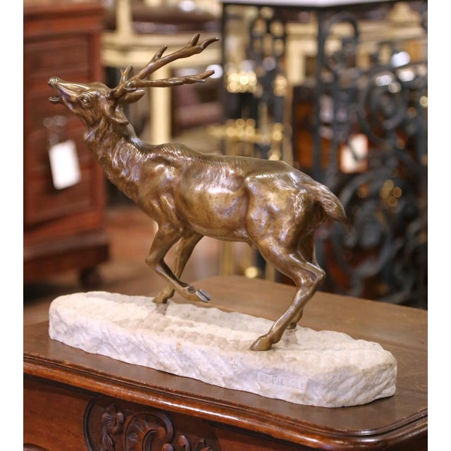 Crafted in France circa 1930, this finely modeled bronze sculpture depicts a majestic elk mid-stride, head lifted in a...