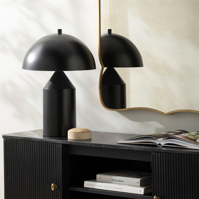 Illuminate your space with the Elder accent table lamp, a striking blend of industrial rustic charm that will captivate...