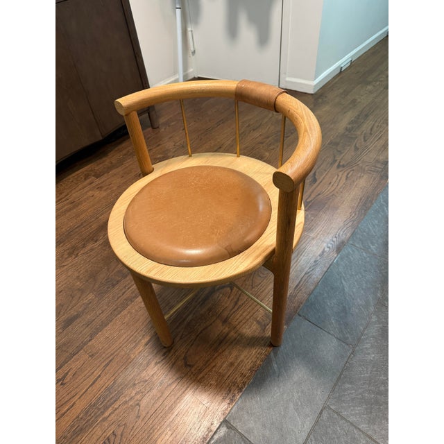 Set of 3 Crump & Kwash Montgomery dining chairs in solid oak with saddle leather seats and brass spindle detailing. High-...