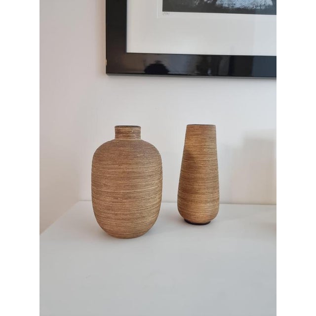 A set with two vases, with a warm organic structure. Signed Ekeby designed by Greta Runeborg, Sweden mid-1900s. Smaller...