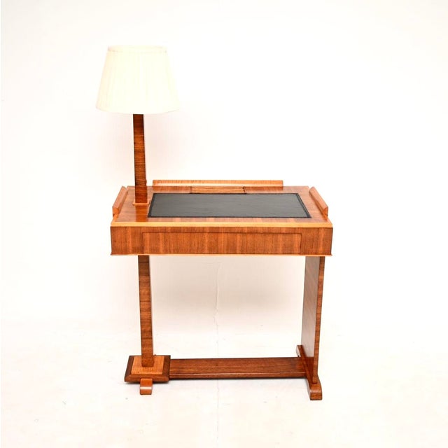 An outstanding and extremely rare Art Deco walnut and sycamore desk with integrated lamp. This was made in England, it...