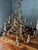 An extraordinary and highly sculptural French Rococo–style crystal chandelier of impressive scale. Measuring approximately...