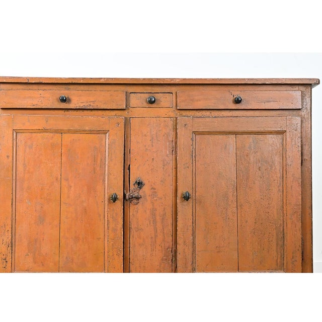 A gorgeous, rustic English pine buffet circa 1870 that would make a fine accent to any space. The top is made from three...