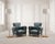 A stylish and charming pair of 20th century French Art Deco club chairs, upholstered in a deep green leatherette naugahyde...