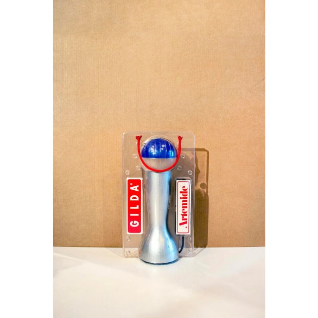 Table lamp with plastic structure and metal. Model Gilda Designer Silvia Capponi Artemide manufacturer 1993 This piece has...