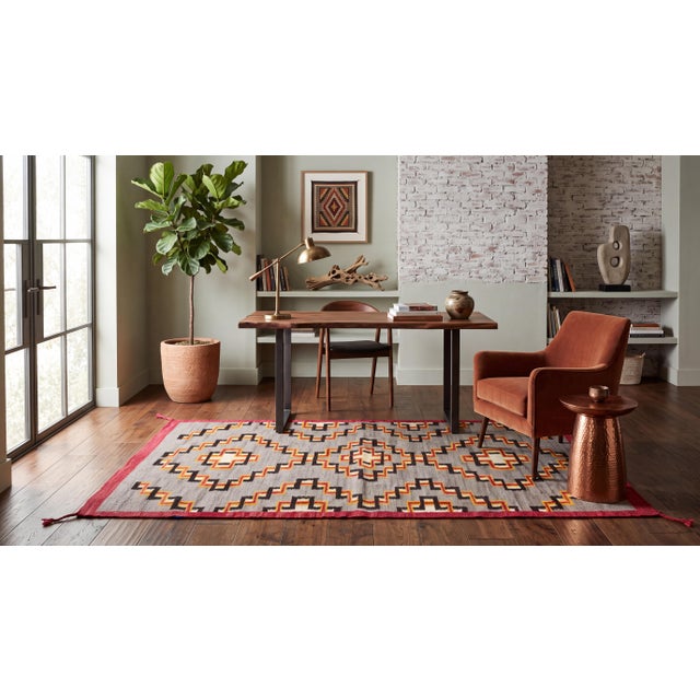 Elevate high-end interiors with this striking modern Southwest Navajo-style flat-weave wool rug. Featuring bold stepped-...