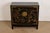 A gorgeous Hollywood Regency Chinoiserie bar cabinet By Drexel Heritage USA, Circa 1980s Black lacquered mahogany, with...