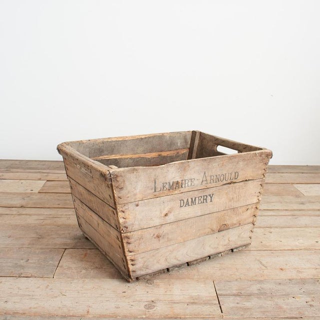 A grape collection wooden crate from a French vineyard in the Champagne region of France. The trug is stamped with the...
