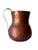 Vintage hand-hammered copper pitcher with a warm, richly patinated finish and classic jug form. Showcasing artisanal...