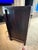 This 1930s Chinese cabinet is finished in black with hand-painted chinoiserie decoration across its doors and sides. Its...