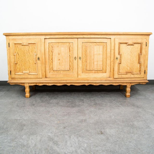 Large Henning Kjernulf White Oak Credenza with locking doors, storage shelving and drawers within. This size and style is...