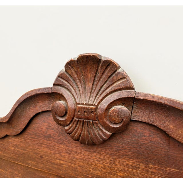 Elegant antique French Provincial wall mirror, crafted in France and dating to approximately 1890–1900. Made from warm-...