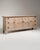Executed in France circa 1970, this commanding oak buffet exemplifies the raw, sculptural energy of the Brutalist movement...