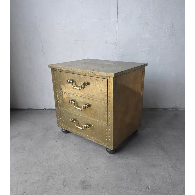 A brass classic. Love Sarreid? These chests are the epitome. Brass riveted three-drawer chest. Gorgeous patina. Made in...