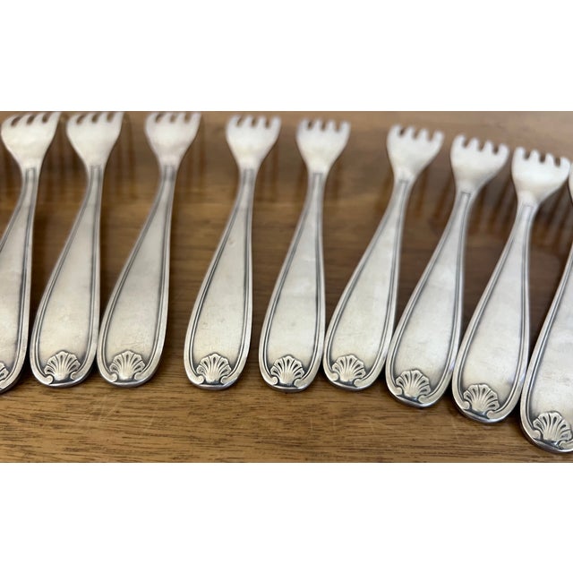 Set of twelve silver plated forks in the Clerment Marot pattern, made in France by Christofle in the 1980's.