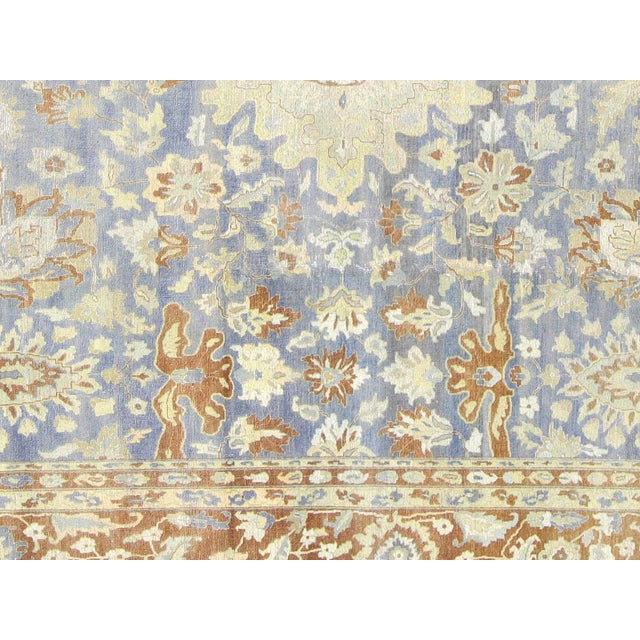 This Vintage Persian Tabriz Rug was expertly hand-woven in the Tabriz region of Iran using wool on a cotton foundation. It...