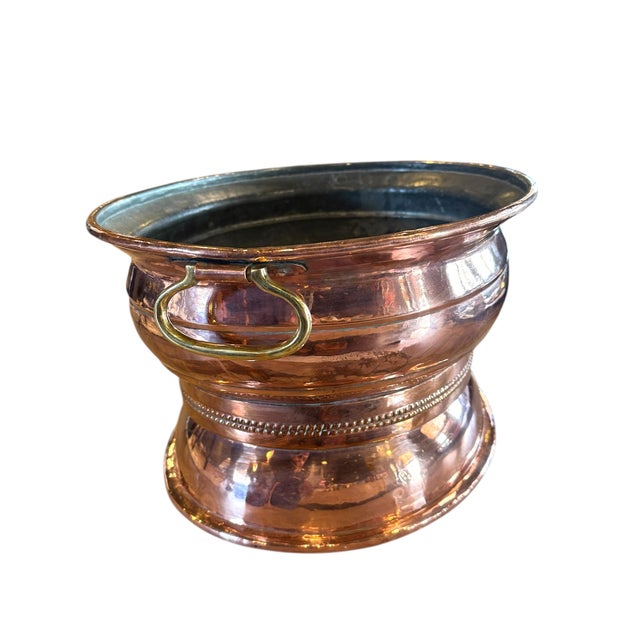 The Oval Copper Wine Cooler is a stylish and functional addition to any home bar or kitchen. Made from high-quality copper...