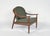 This stunning 1960s curved spindle back lounge chair in teak, was made by the highly revered english company greaves &...