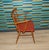 A particularly beautiful, rustic chair from the 1950s/60s Finely crafted beechwood frame with a slatted back and armrests...