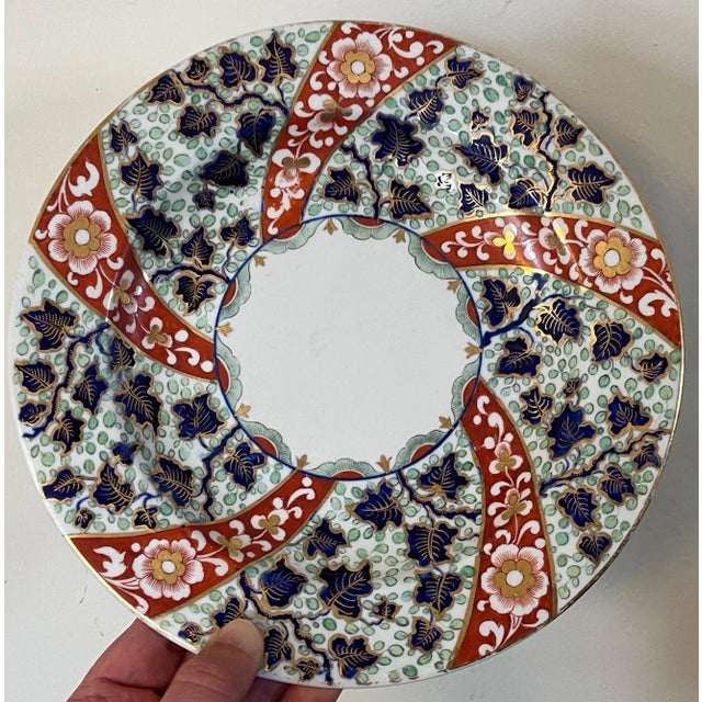 Large antique early 19th century Derby porcelain imari plate. Decorated front and back. Measures 9 3/4" diameter. Good...