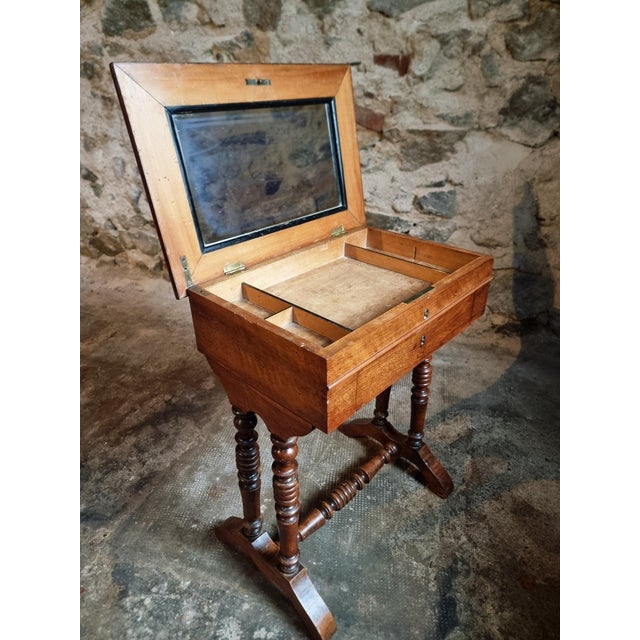 This antique French sewing table, also known as a travailleuse, dates from the 19th century and originates from France....