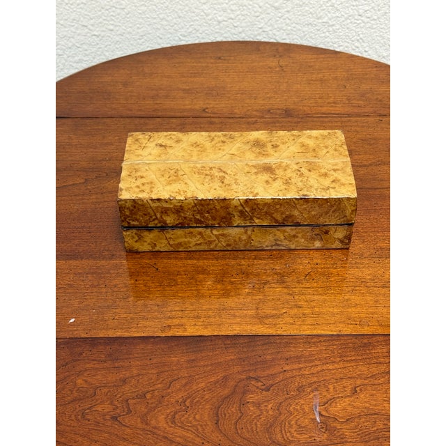 Design Plus Gallery presents a Vintage Burl Wood Keepsake Box. A rectangular form displays patterned burl veneer, rounded...