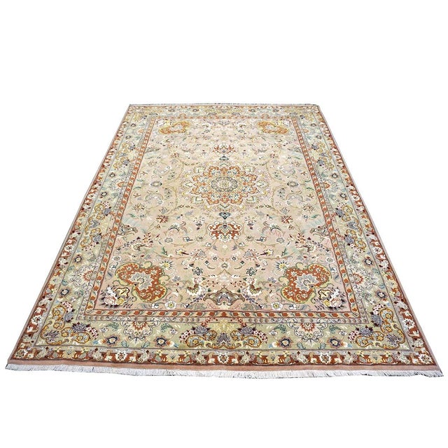 Condition: Vintage Circa: 2000s Origin: Persia Design: Tabriz Actual size: 6'8" x 9'8" Thickness: 1/4 In. Color: Light...
