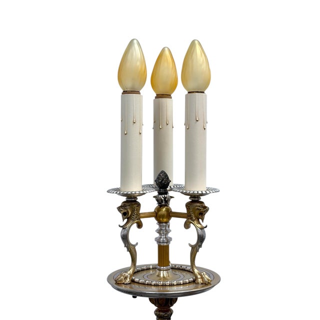 Heavy solid brass parts on this nice candlestick lamp, with plated embellished accents. Only the interior unseen center...