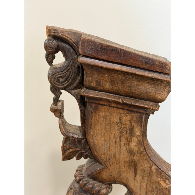 A striking one-of-a-kind decorative sculpture created from a hand-carved Indian architectural wood fragment, mounted on a...