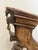 A striking one-of-a-kind decorative sculpture created from a hand-carved Indian architectural wood fragment, mounted on a...