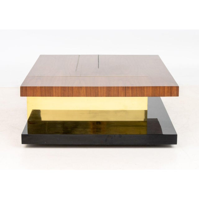 Brabbu "Lallan" Coffee Table, with walnut top above gilt brass undertier above black lacquered base. 14.75" H x 47.25" W x...