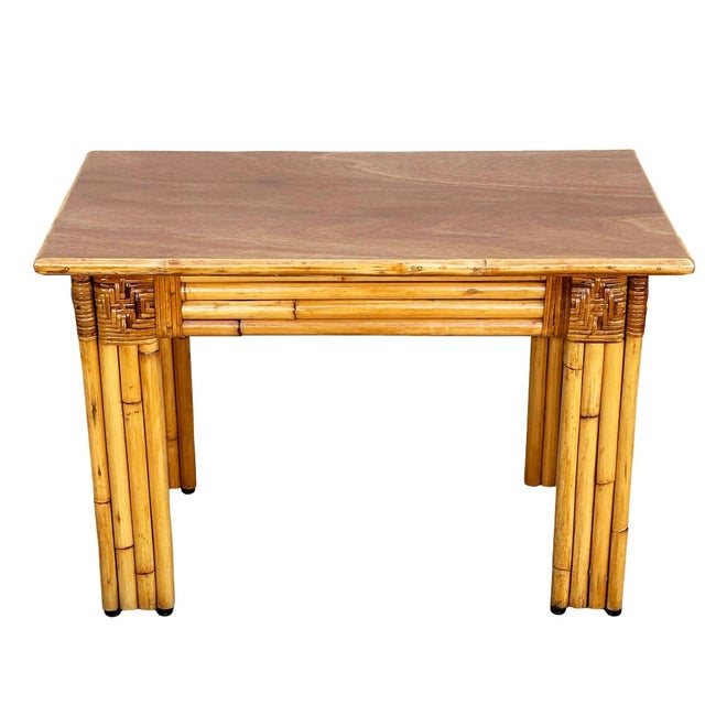 This beautifully restored 30" wide console table with 7-strand vertically stacked rattan legs and a mahogany wood top with...