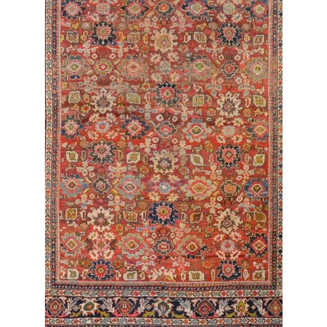 An outstanding early 20th century Persian Mahal rug with an incredible all-over pattern of myriad flowers and leaves woven...