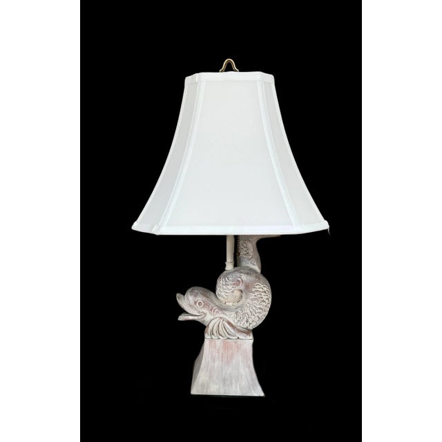 This distinctive table lamp brings a touch of coastal elegance to any space. The lamp features a beautifully sculpted...