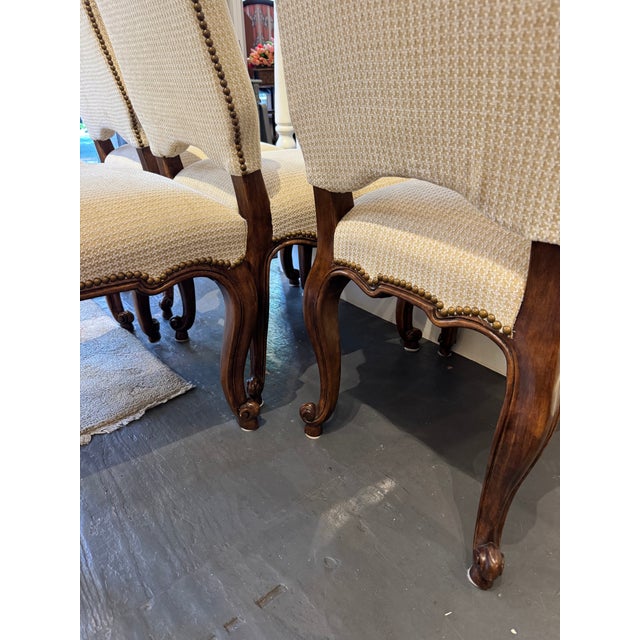 This is a set of ten, 20th century vintage French dining chairs. The wood is mahogany. It has houndstooth and chenille...