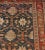 This traditional hand-woven Persian Malayer rug has a dark navy field with overall design of stepped lozenge lattice...