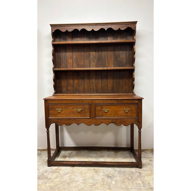 A most appealing early 20th century English oak dresser, notable for the richness of its colour and the striking beauty of...