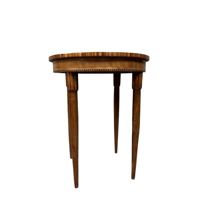 Art deco marquetry state table art deco marquetry state table, circa 1930. circular top with a frieze. flushed legs with...
