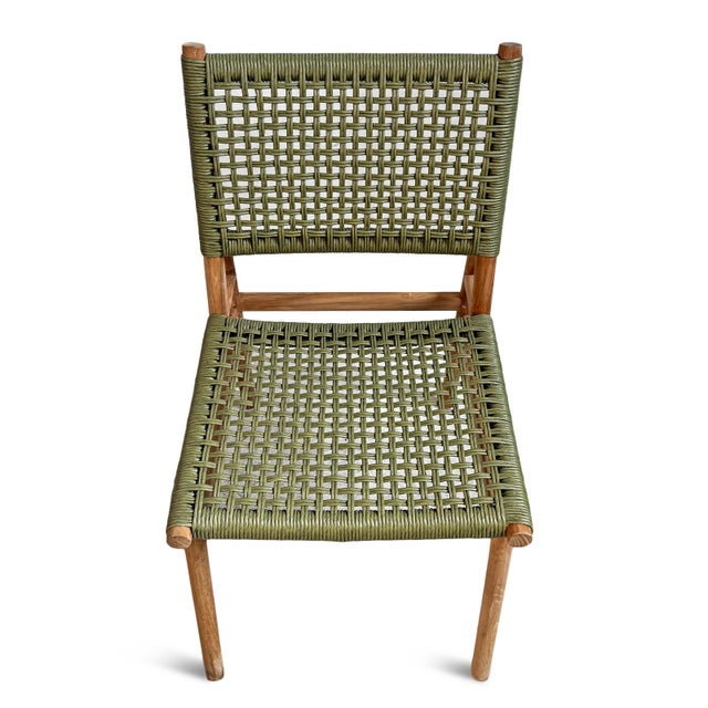 Stylish outdoor dining chair with smooth teak wood frame and sage/moss green twisted faux rattan woven seat and back. Each...
