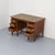 Characteristic Dutch desk from the 1910s–1920s, executed in oak with an inset linoleum writing surface. The design is...