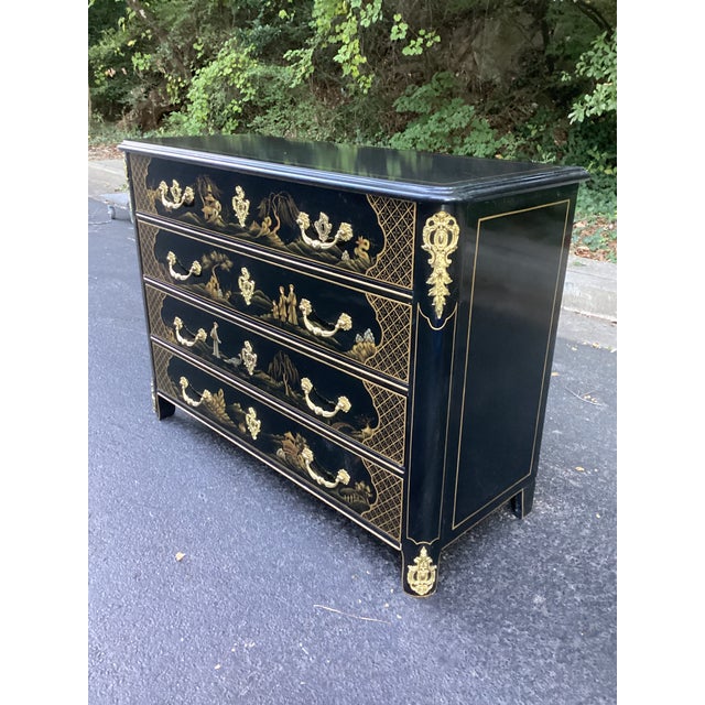 An elegant four-drawer commode attributed to Baker Furniture’s Collector’s Edition, combining French-inspired form with...