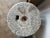 Beautiful side table or drink table with an antique millstone top and a round bronze base. Millstones were used to grind...