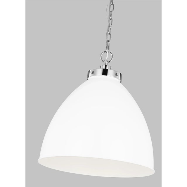 Inspired by various classic utility silhouettes - from factory lighting to barn sconces - capped by contrasting metal...