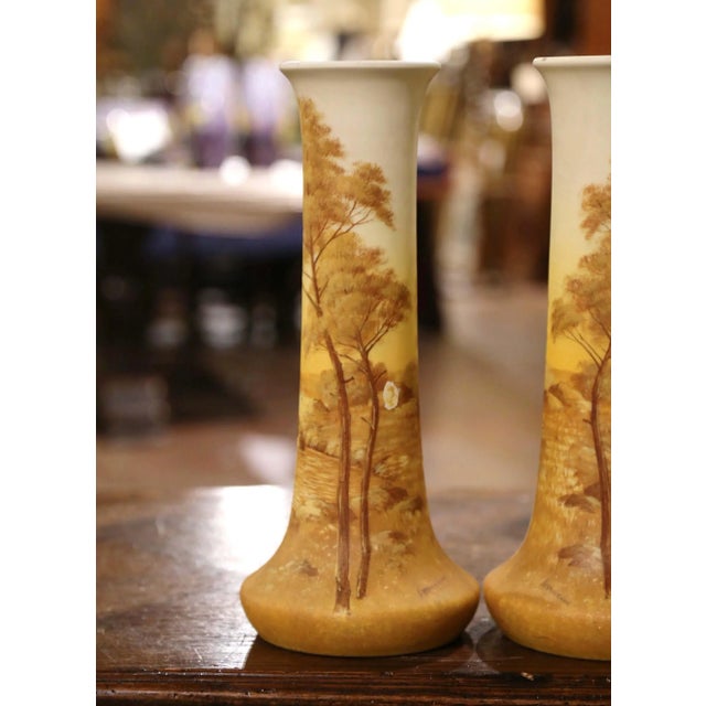 Decorate a mantel or a console with this elegant pair of antique enamel vases. Created in southern France, the colorful...