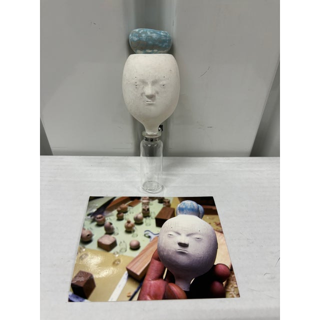 1 Owner and bought at GR2 Giant Robot. Show. Beautiful and delicate work. 2 screws at back screw into the wall. On...