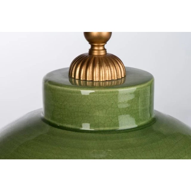 A modern pearl drop table lamp adds posh appeal with its ceramic body and green finish. Adding subtle color when combined...